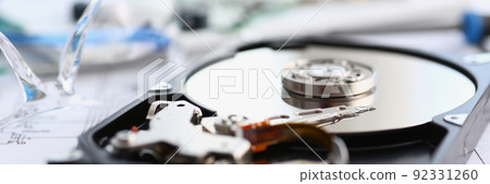 Disassembled hard drive from pc hdd and reader arm, made of plastic and metal 92331260
