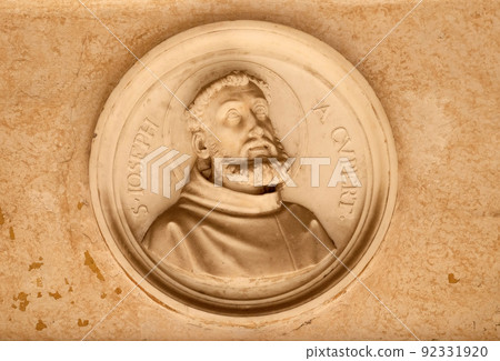 Saint Joseph of Cupertino, bass relief in portico of church dei Santi XII Apostoli in Rome, Italy Saint Joseph of Cupertino, bass relief in portico of church dei Santi XII Apostoli in Rome, Italy 92331920