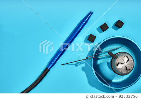 Top view of Hookah parts on light blue background 92332756