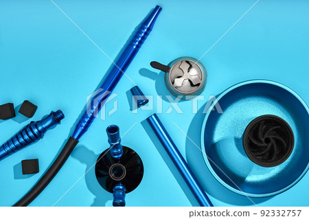 Top view of Hookah parts on light blue background 92332757