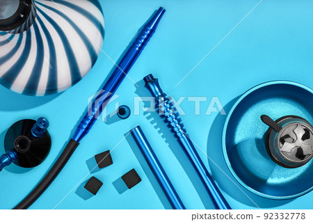 Top view of Hookah parts on light blue background 92332778