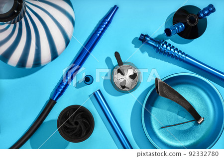 Top view of Hookah parts on light blue background Top view of Hookah parts on light blue background 92332780