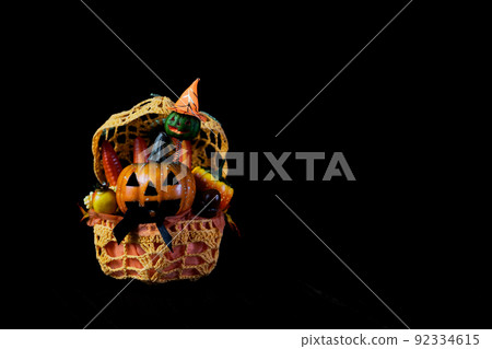 Halloween pumpkin ghost Jack O Lantern figurine taken on a black background 92334615