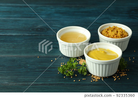 Bowls with sauces on wooden table, space for text Bowls with sauces on wooden table, space for text 92335360