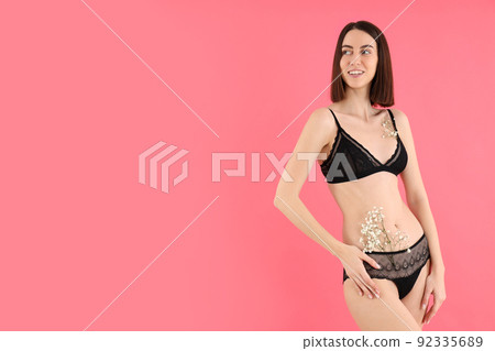 Concept of underwear with young woman on pink background 92335689