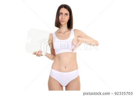 Concept of weight loss with young slim woman isolated on white background 92335703