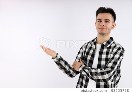 Attractive guy in shirt on white background 92335728