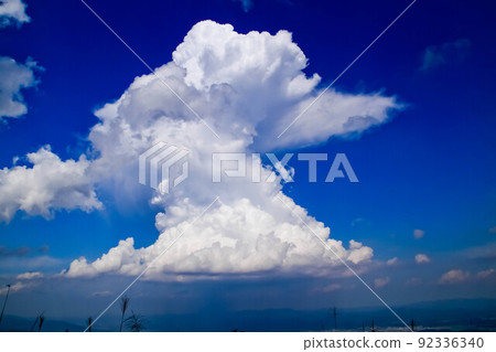 Cumulonimbus clouds seen from a mountain road 92336340