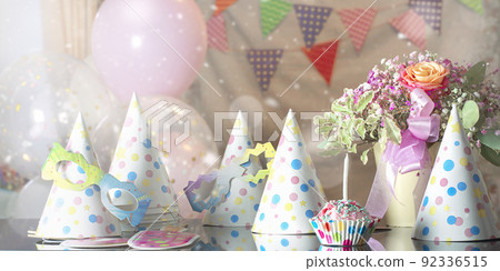 Many holiday caps polka dot flags ballons flowers cake with candle decoration. Many holiday caps polka dot flags ballons flowers cake with candle decoration. 92336515