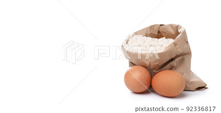 Flour with eggs isolated on white background Flour with eggs isolated on white background 92336817
