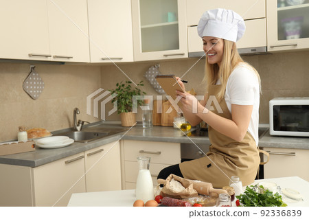 Concept of home cooking with female chef 92336839