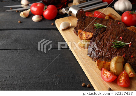 Concept of tasty food with beef steaks, space for text Concept of tasty food with beef steaks, space for text 92337437