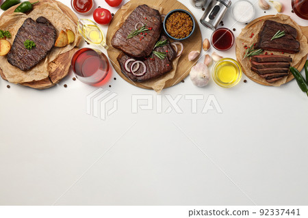 Concept of tasty food with beef steaks, space for text 92337441