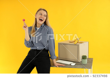 Concept of April Fool's Day on yellow background Concept of April Fool's Day on yellow background 92337498