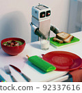 Cute robot cooking the soup  92337616