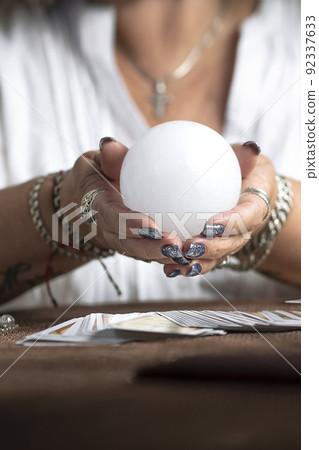 Concept of psychic advisor or ways of divination with cards. Concept of psychic advisor or ways of divination with cards. 92337633