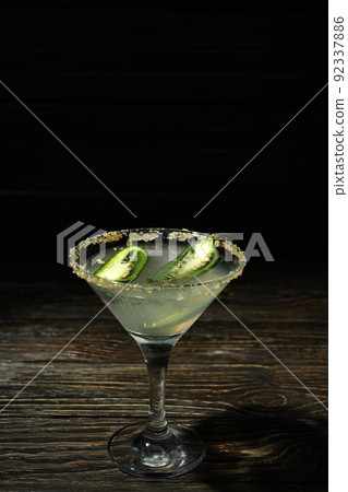 Glass of Jalapeno cocktail on rustic wooden background 92337886