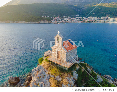 Sveta Nedelja is an islet on the Adriatic Sea, in Montenegrin municipality of Budva. It is located opposite the town of Petrovac na Moru in Montenegro. It has a small church on it Portrait of a Sveta Nedelja is an islet on the Adriatic Sea, in Montenegrin municipality of Budva. It is located opposite the town of Petrovac na Moru in Montenegro. It has a small church on it Portrait of a 92338394