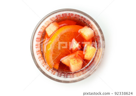 Glass of Sangria drink isolated on white background Glass of Sangria drink isolated on white background 92338624