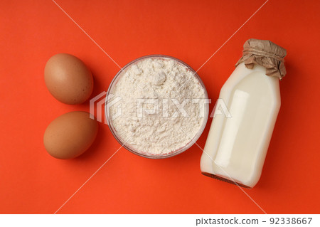 Ingredients for pie or cake cooking on orange background 92338667