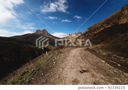 Autumn day on a scenic but difficult 4X4 track located in front of the summit. Off-road, wide angle 92339228