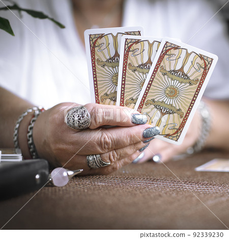 Concept of psychic advisor or ways of divination with cards. Concept of psychic advisor or ways of divination with cards. 92339230