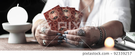 Concept of psychic advisor or ways of divination with cards. Concept of psychic advisor or ways of divination with cards. 92339257