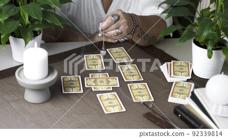 Concept of psychic advisor or ways of divination with cards. Concept of psychic advisor or ways of divination with cards. 92339814
