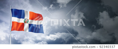 Dominican Republic flag on a cloudy sky 92340337