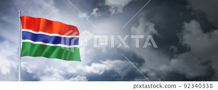 Gambian flag on a cloudy sky 92340338