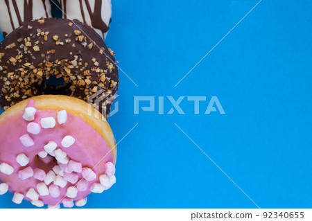 donuts on blue background donuts on blue background 92340655