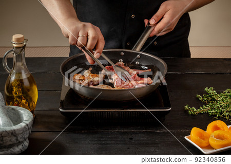 Chef cook the quail into the frying pan Chef cook the quail into the frying pan 92340856