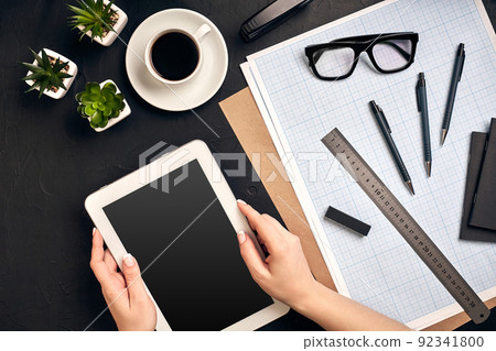 Architect working on blueprint. Architects workplace - architectural project, blueprints, tablet pc. Engineering tools. Top view 92341800