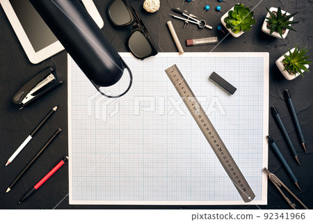 Top view of the builder's workplace, ruler, paper for drawings, compasses, glasses, tablet 92341966