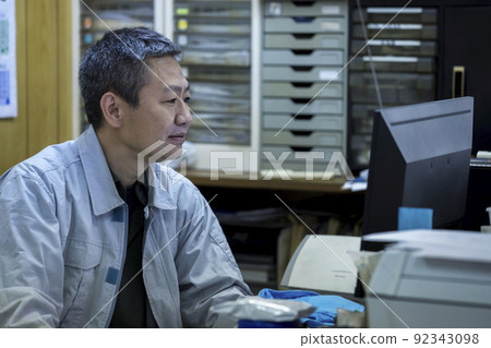 Middle man doing desk work in the office of the company 92343098