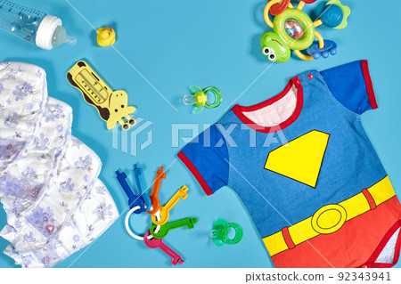 Baby clothing, toiletries, toys and health care accessories on blue background. 92343941
