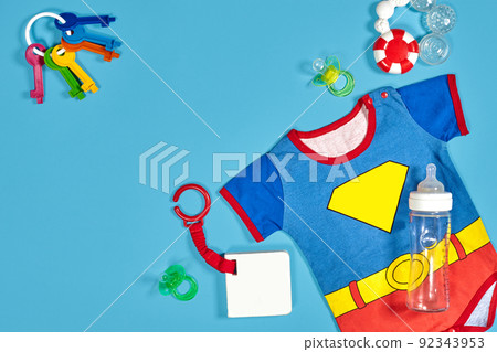 Baby clothing, toiletries, toys and health care accessories on blue background. 92343953