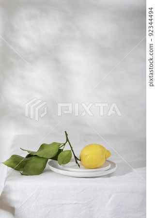 Fresh lemon with green leaves Fresh lemon with green leaves 92344494