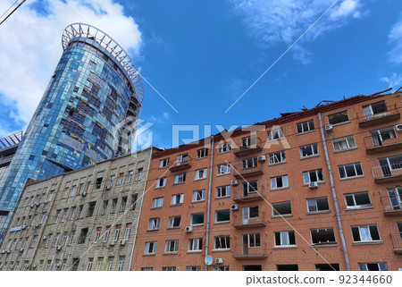 Kyiv, Ukraine - July 10, 2022: The building renovation after Russian rocket attack on Kyiv Kyiv, Ukraine - July 10, 2022: The building renovation after Russian rocket attack on Kyiv 92344660
