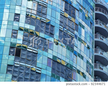 Kyiv, Ukraine - July 10, 2022: The building renovation after Russian rocket attack on Kyiv Kyiv, Ukraine - July 10, 2022: The building renovation after Russian rocket attack on Kyiv 92344671