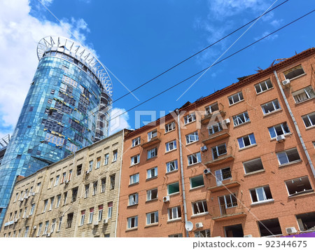 Kyiv, Ukraine - July 10, 2022: The building renovation after Russian rocket attack on Kyiv Kyiv, Ukraine - July 10, 2022: The building renovation after Russian rocket attack on Kyiv 92344675