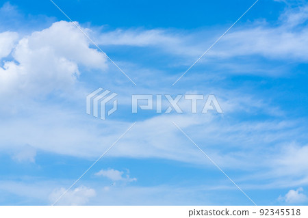 A refreshing summer sky and a faint white cloud 92345518