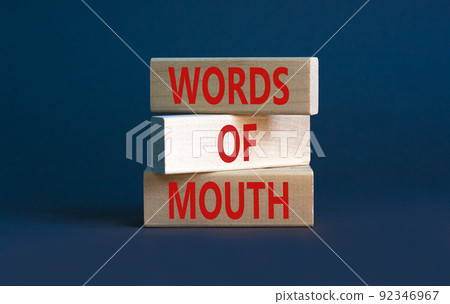 Words of mouth symbol. Concept words Words of mouth on wooden blocks on a beautiful grey table grey background. Business, finacial and words of mouth concept. Copy space. 92346967