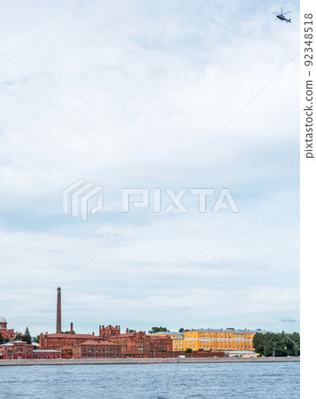 Helicopter flying over the Neva River in St. Petersburg, Russia and Kresty prison, vertical photo Helicopter flying over the Neva River in St. Petersburg, Russia and Kresty prison, vertical photo 92348518