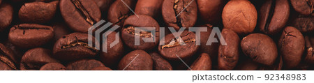 Coffee lover view of roasted coffee beans for background and texture. Dumped roasted coffee beans can be used as background and texture. Photo banner. roasted coffee 92348983
