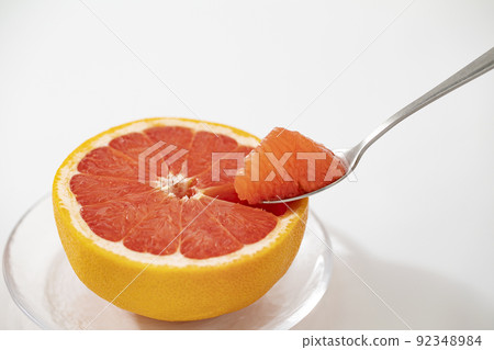 Ruby grapefruit on a glass plate 92348984