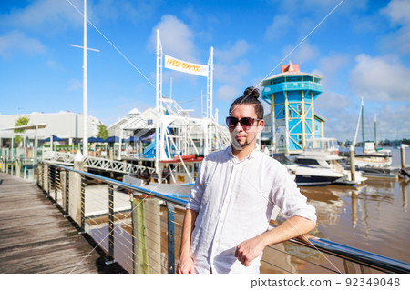 Latin men wearing sunglasses and the blue sky in Australia Latin men wearing sunglasses and the blue sky in Australia 92349048