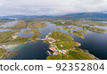 Norway village by the ocean - fjord landscape with cloudy sky panorama 92352804