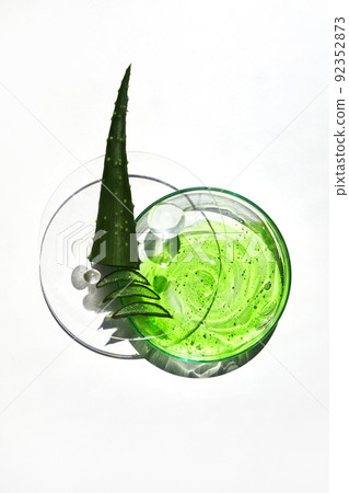 Abstract cosmetic laboratory. Aloe vera cosmetic product, natural ingredients and laboratory glassware. 92352873