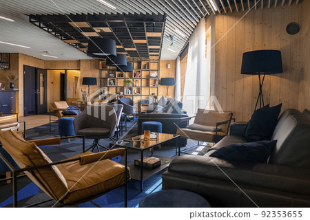 Cozy chairs and sofa arranged in beautiful lounge at luxurious hotel Cozy chairs and sofa arranged in beautiful lounge at luxurious hotel 92353655